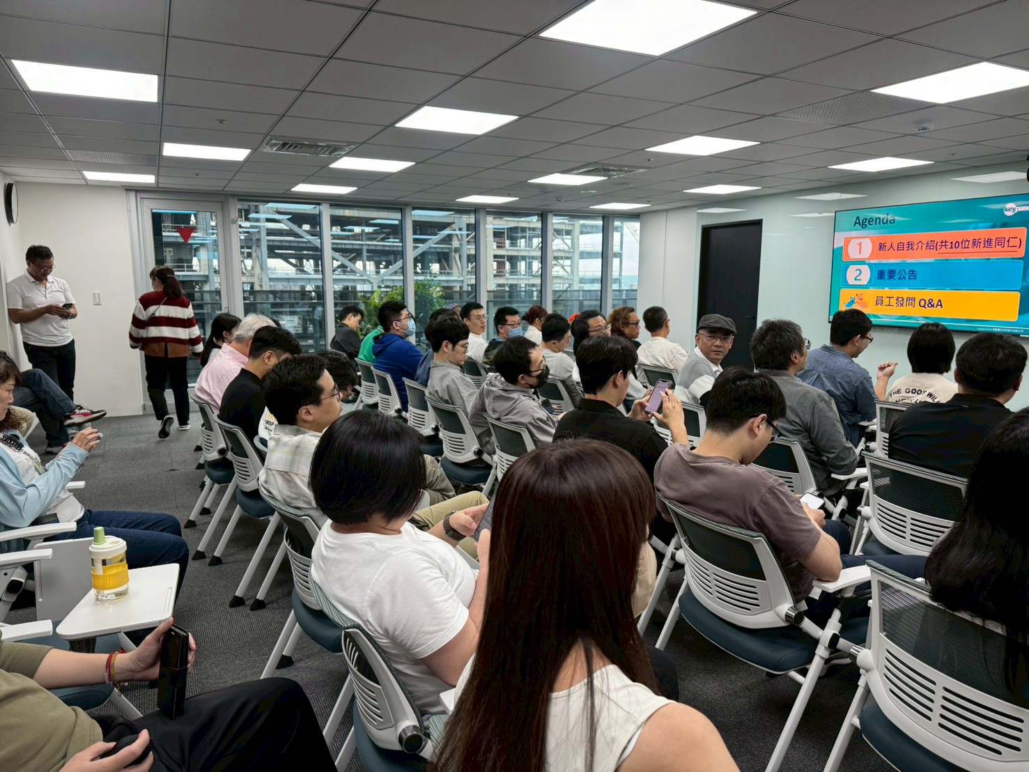 Lydsec Keypasco employees sharing ideas at a company meeting