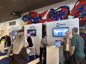Keypasco team speaking with visitors at the ONE Conference 2026 exhibition stand