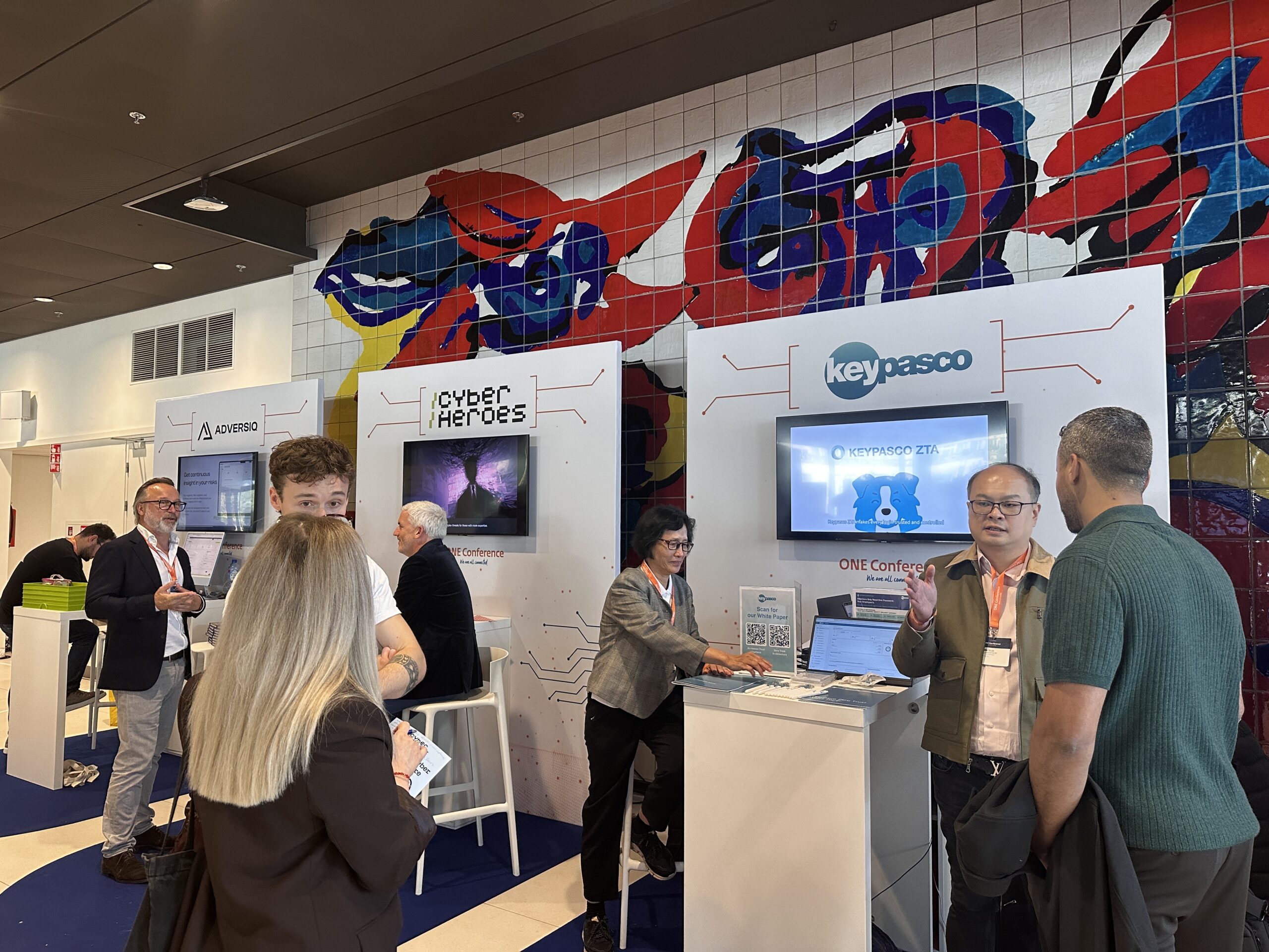 Keypasco team speaking with visitors at the ONE Conference 2026 exhibition stand